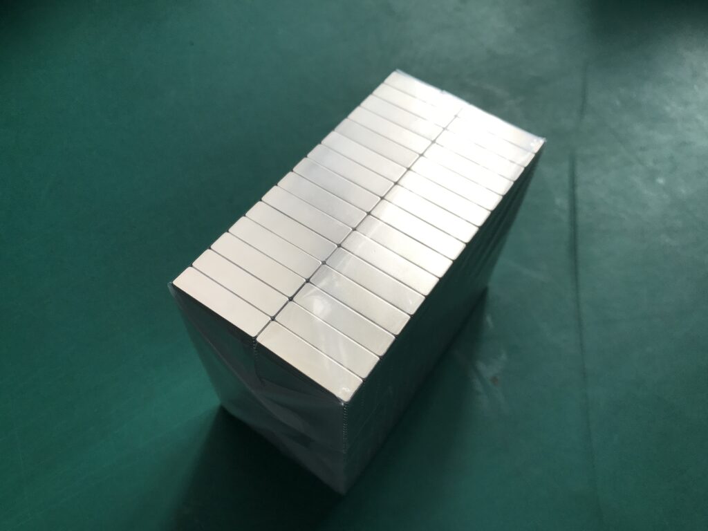 Fig. 1 - Magnets neatly stacked together and wrapped in plastic bags; smaller magnets do not require a spacer