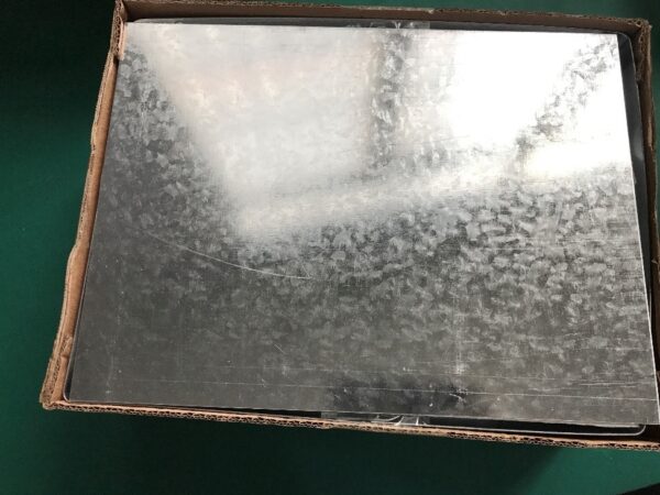 Fig. 5 - Closing the packaging with iron sheets on the top, effectively creating a magnetic shield on all six sides