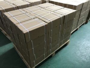 Fig. 7 - Securing the cardboard box with strapping bands